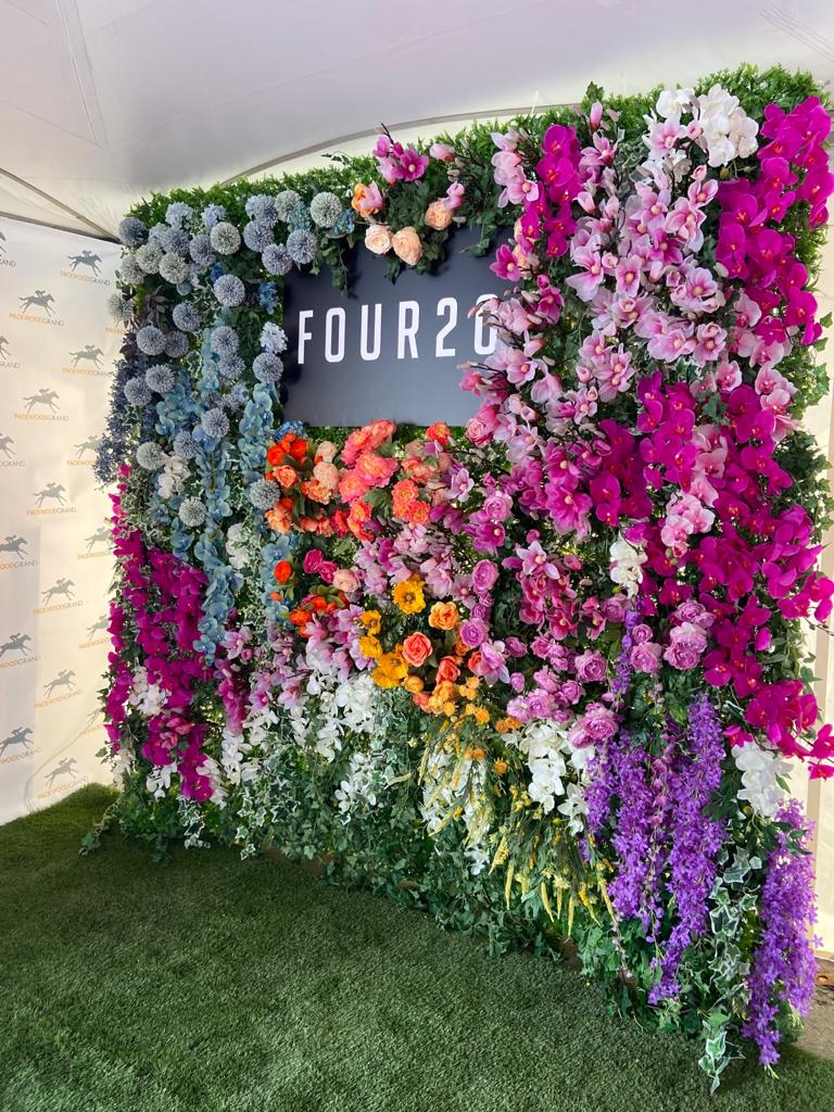Custom Flower Wall Backdrop with Client's Brand Colors at Packwood Grand in Calgary